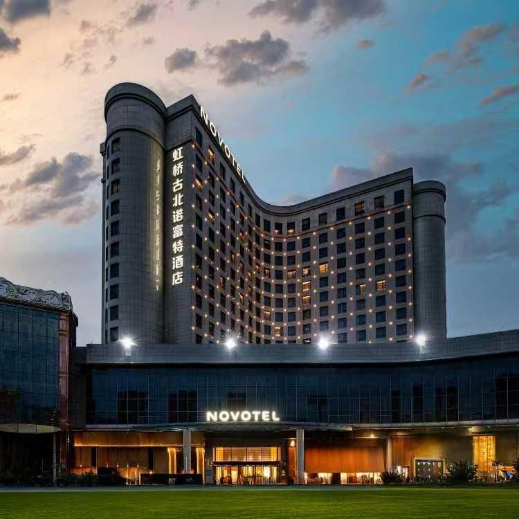 Novotel Shanghai Gubei exterior at dusk